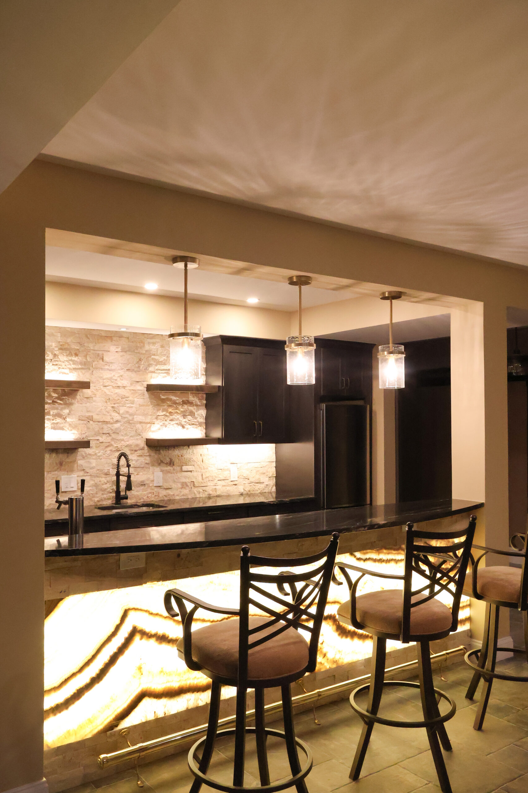 Custom home bar with backlit stone front for a Bar renovation
