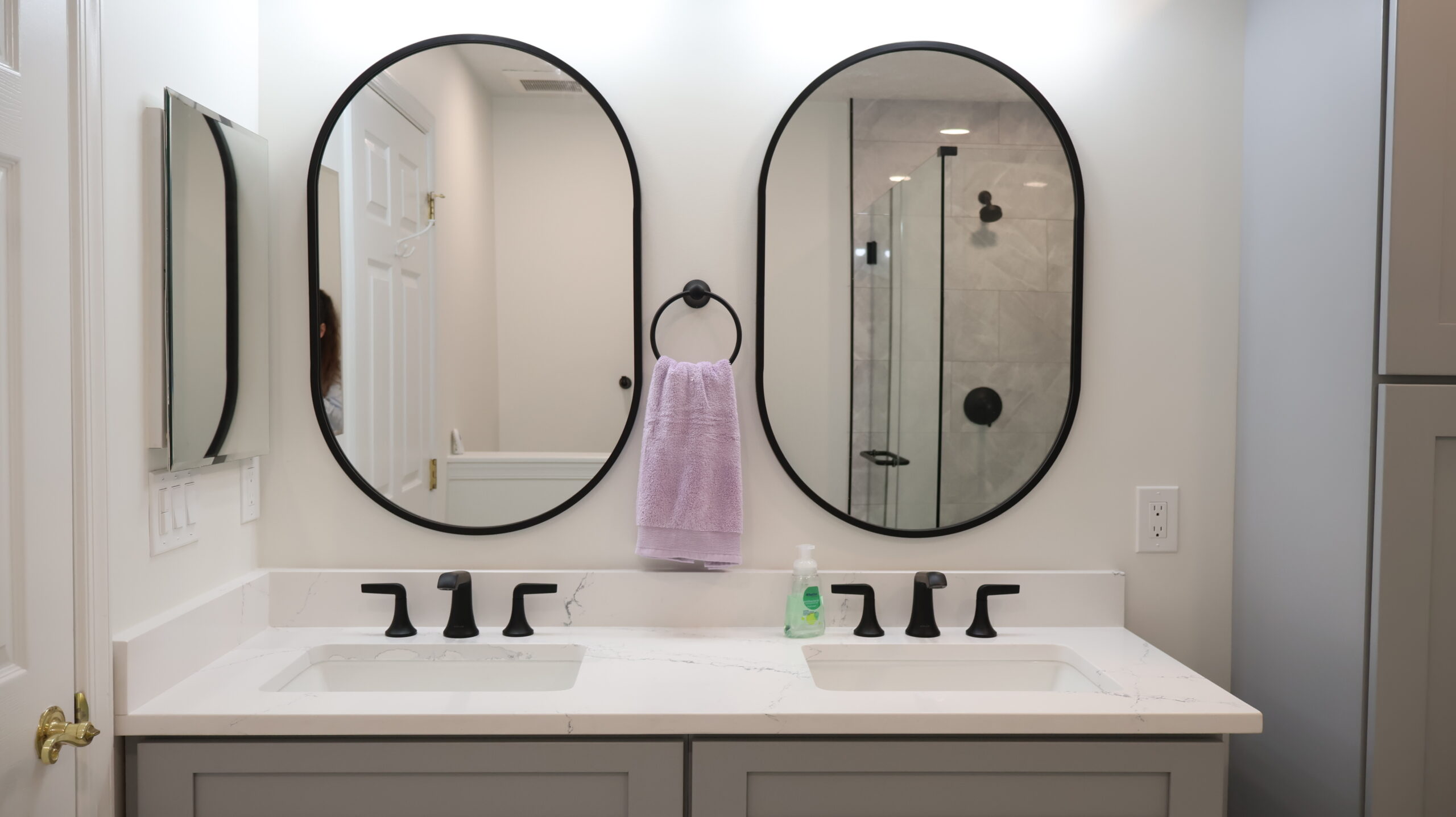 Gray shaker style double vanity with quartz counters for a Bathroom renovation