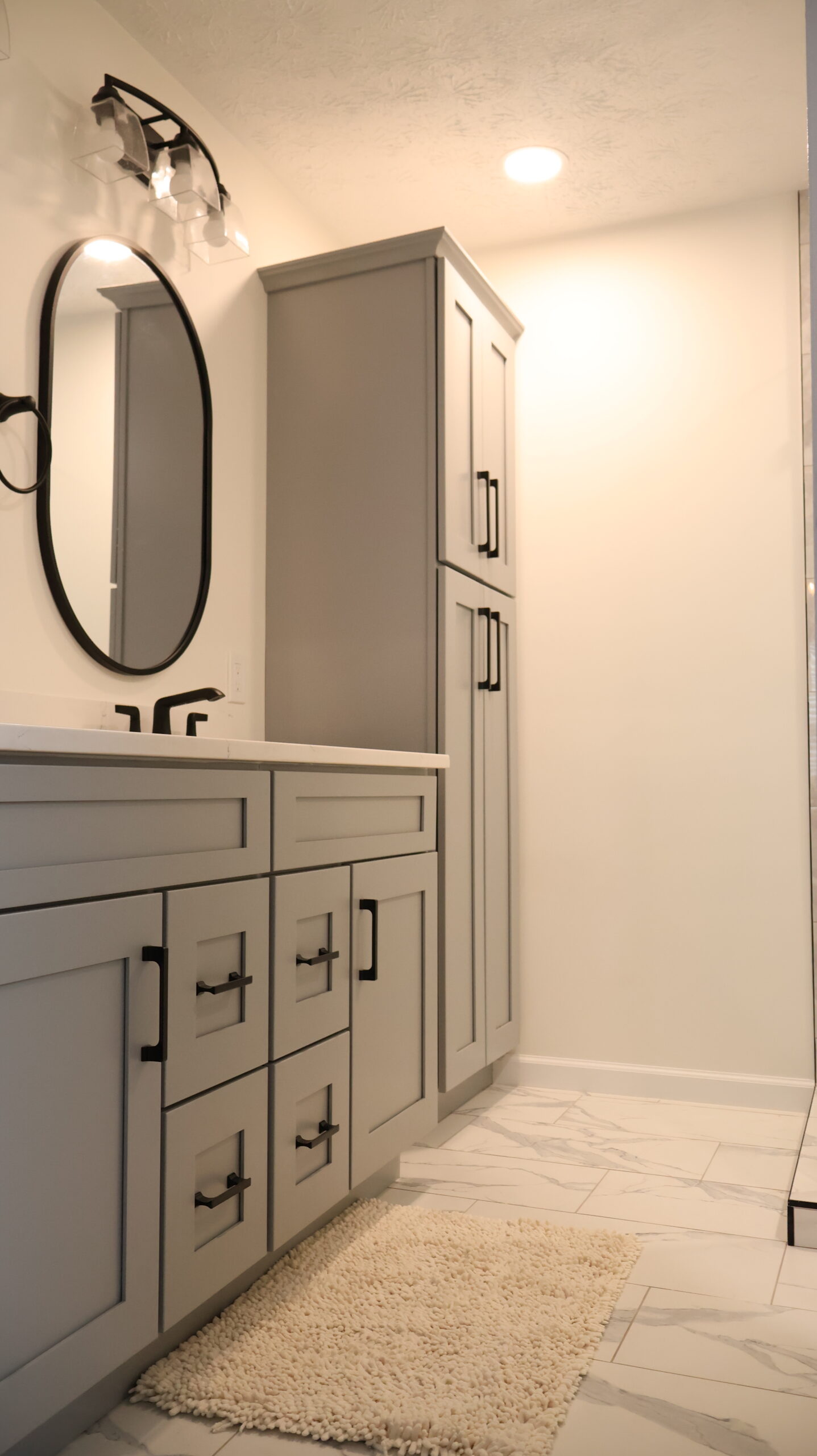 Large format marble look porcelain floor tiles for a Bathroom remodeling