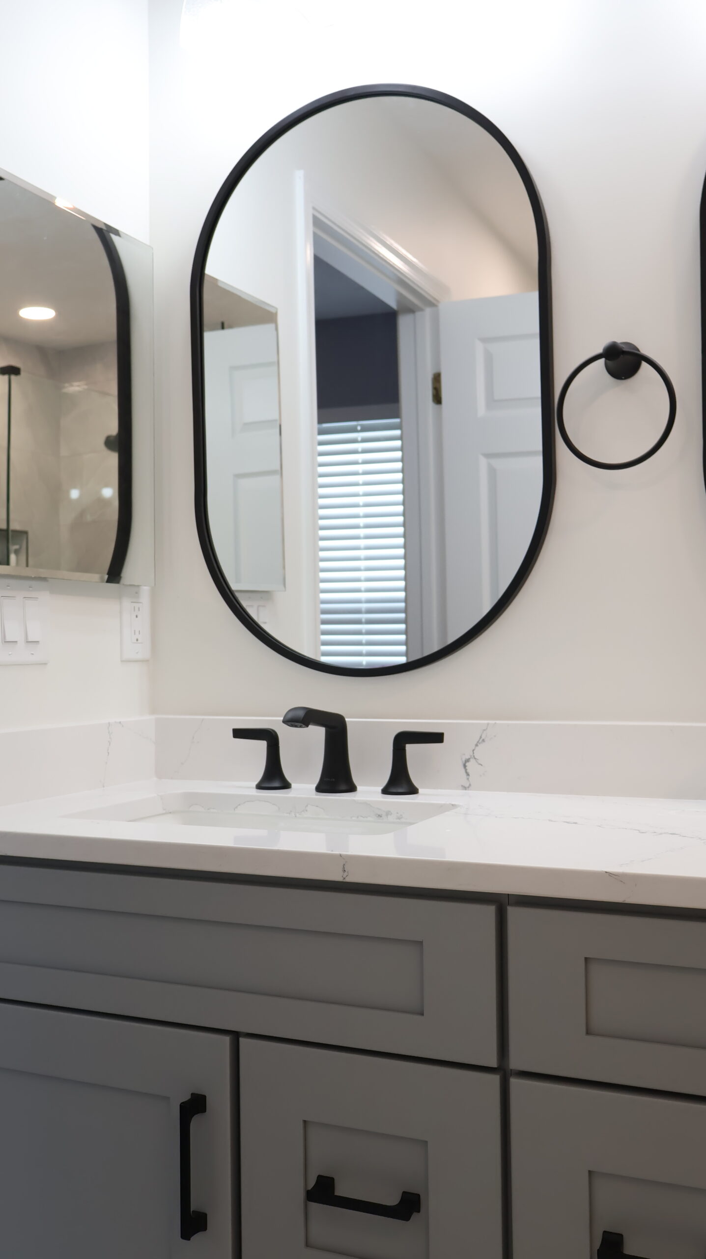 Close up of a matte black widespread faucet for a Bathroom update