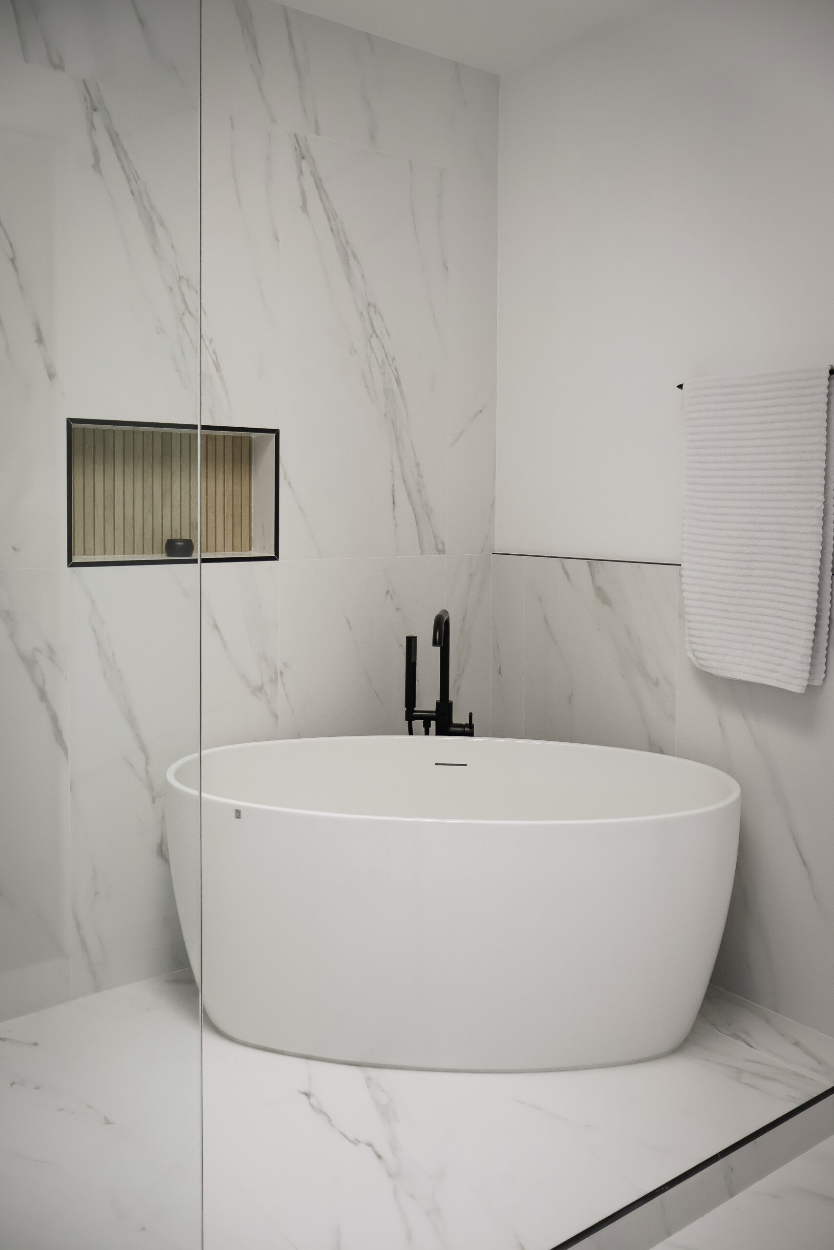 Polished marble look porcelain bathroom floor tiles for a Bathroom remodeling.