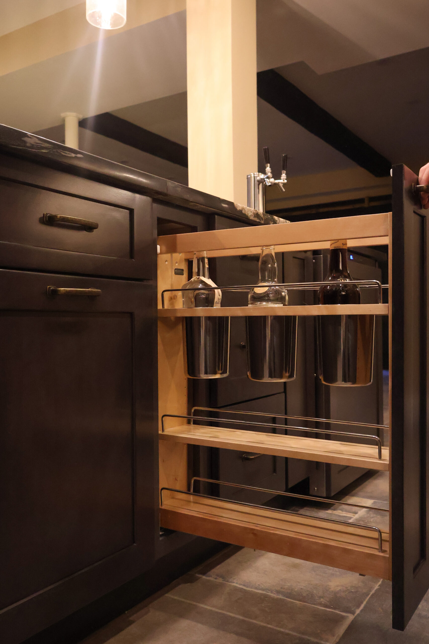 Integrated pull-out bottle rack for high-capacity storage