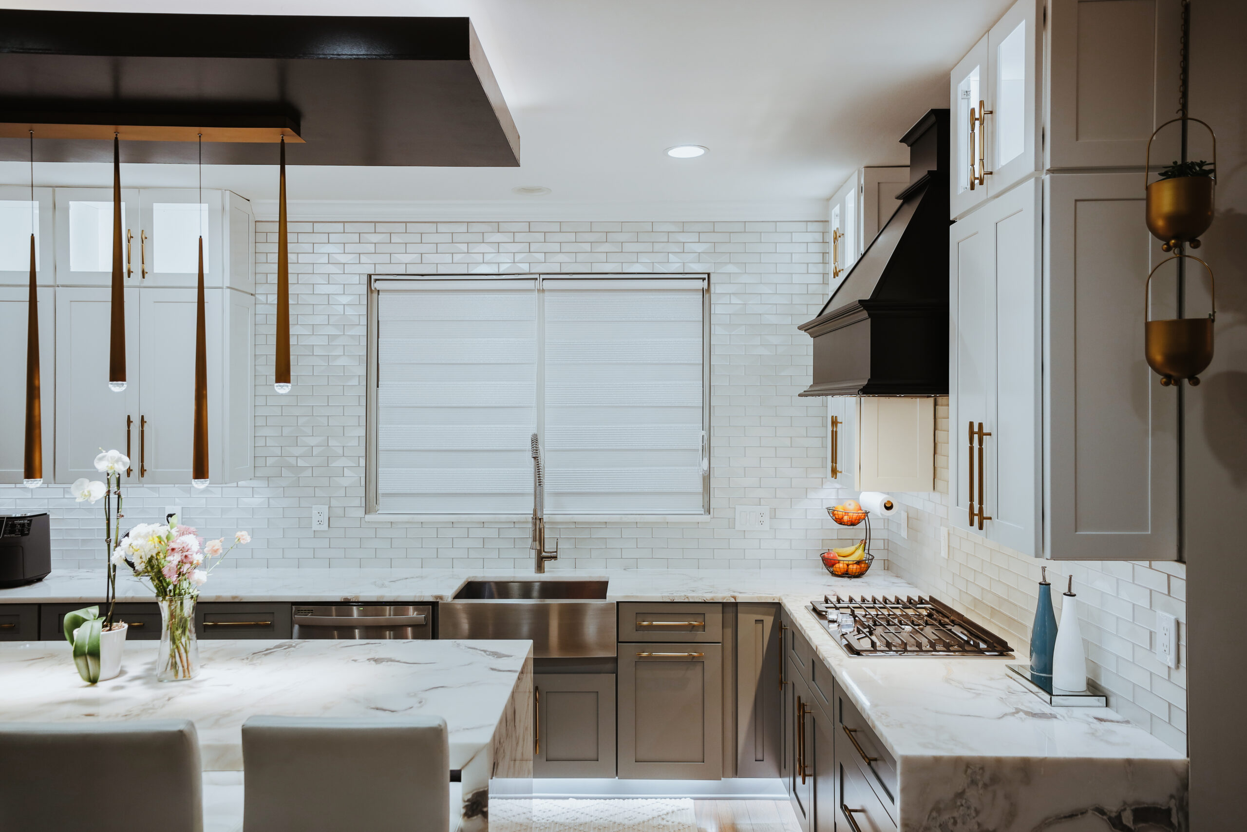Apron front stainless sink with beveled subway tile for a Kitchen renovation