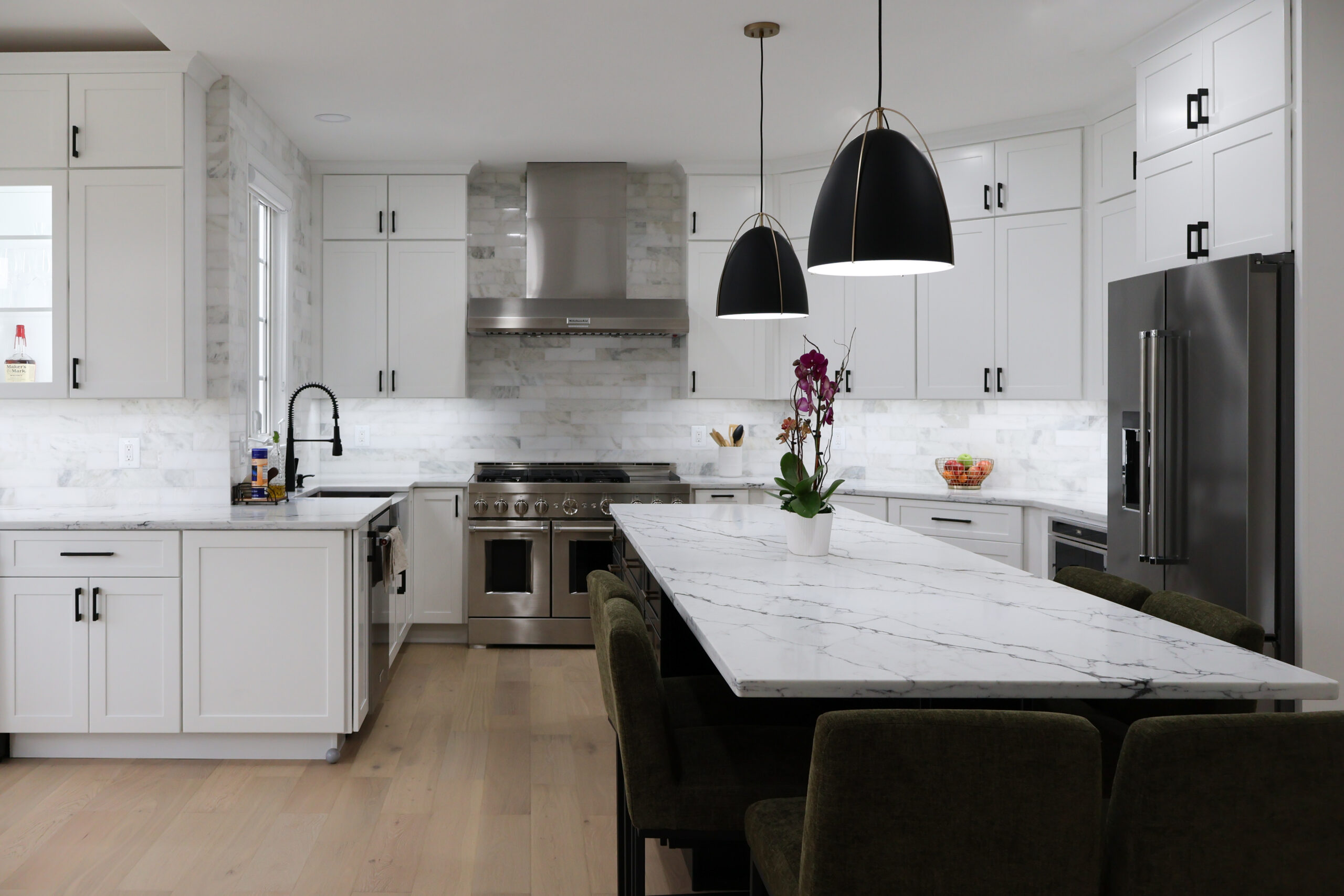 White shaker cabinets and a black contrast island for a Kitchen remodeling.