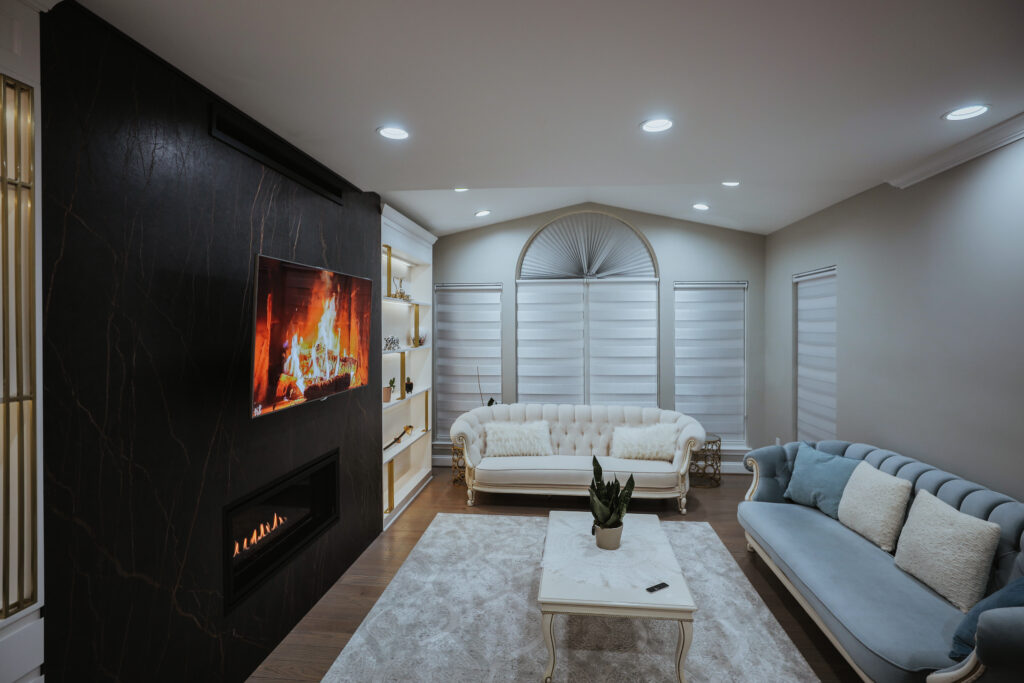 Comfortable basement family room with sofa and fireplace