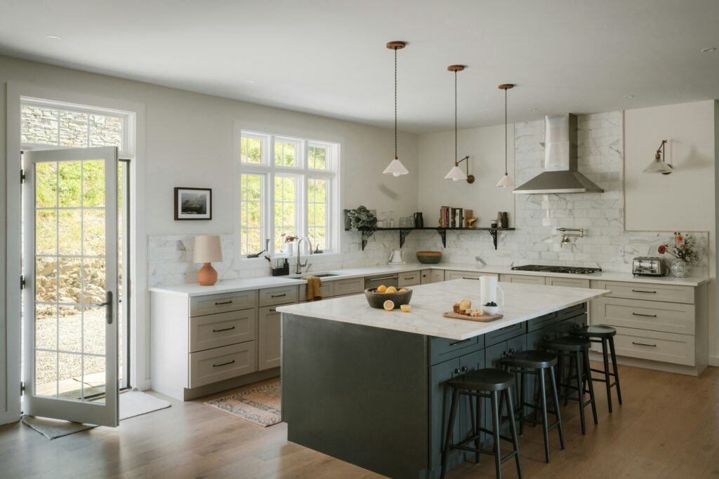 Kitchen island with pendant lights and modern cabinetry