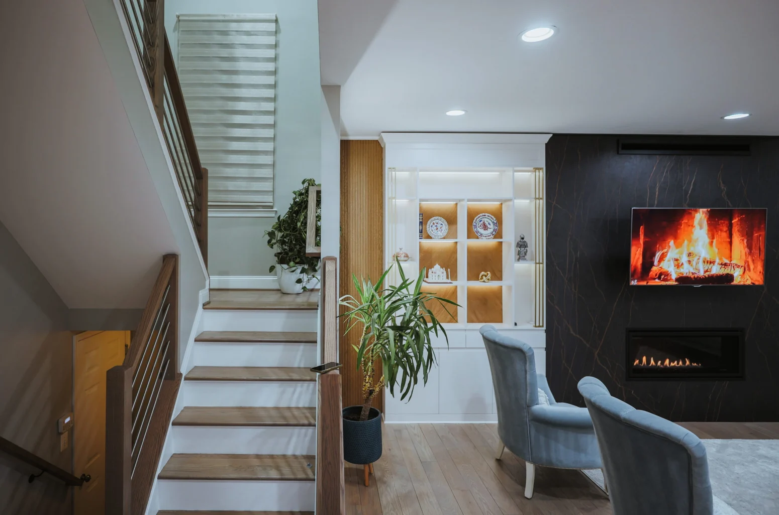 Basement finishing Cherry Hill NJ – custom built-ins, linear fireplace, hardwood stairs by Build Design Center